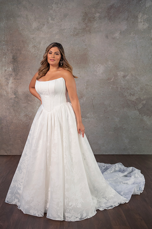 model is wearing a strapless basque waist bridal gown