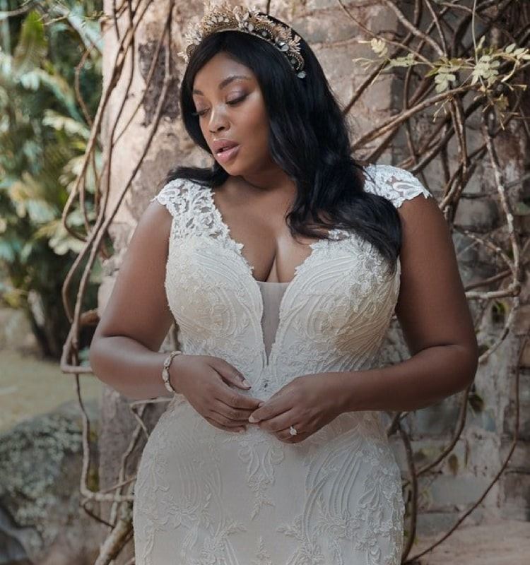 Model wearing a plus size collection gown