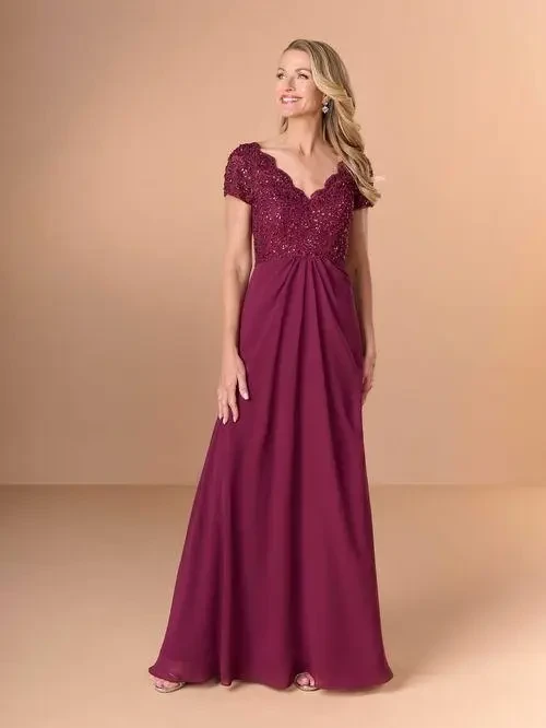 model is wearing a burgundy short sleeve a-line mothers gown