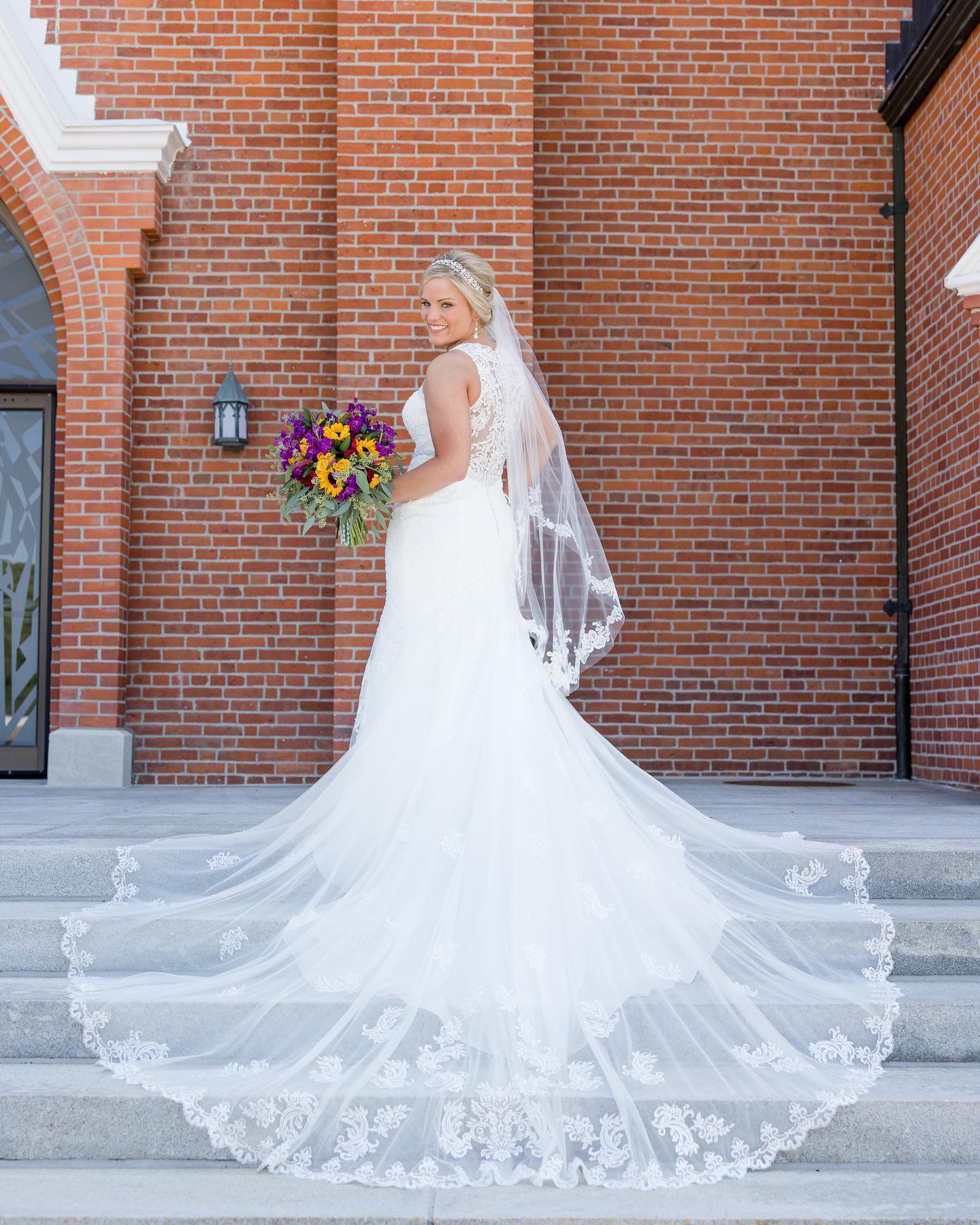 Photo of the smiling real bride with the bouquet