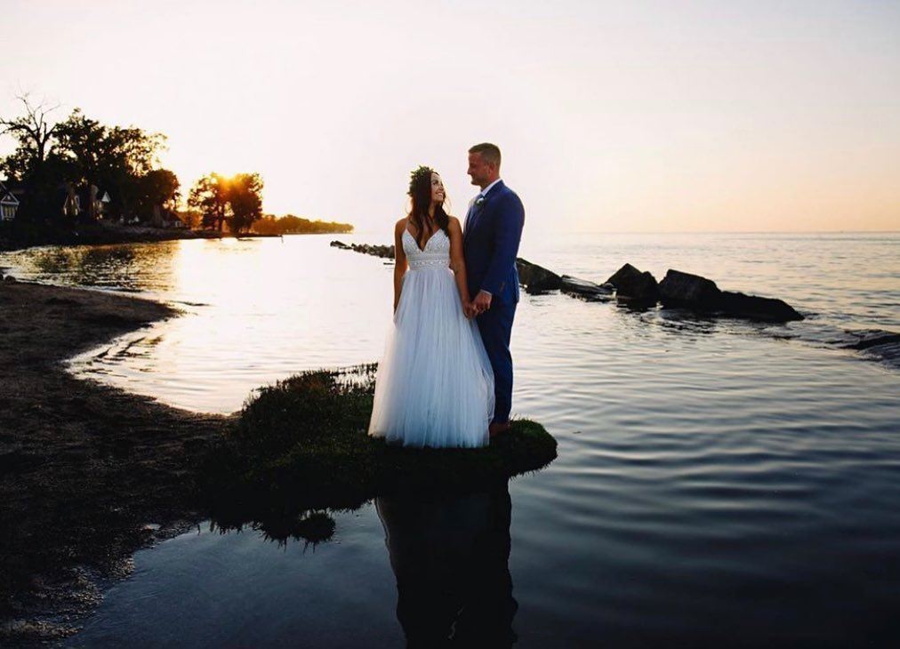 Photo of the real bride and groom near the water