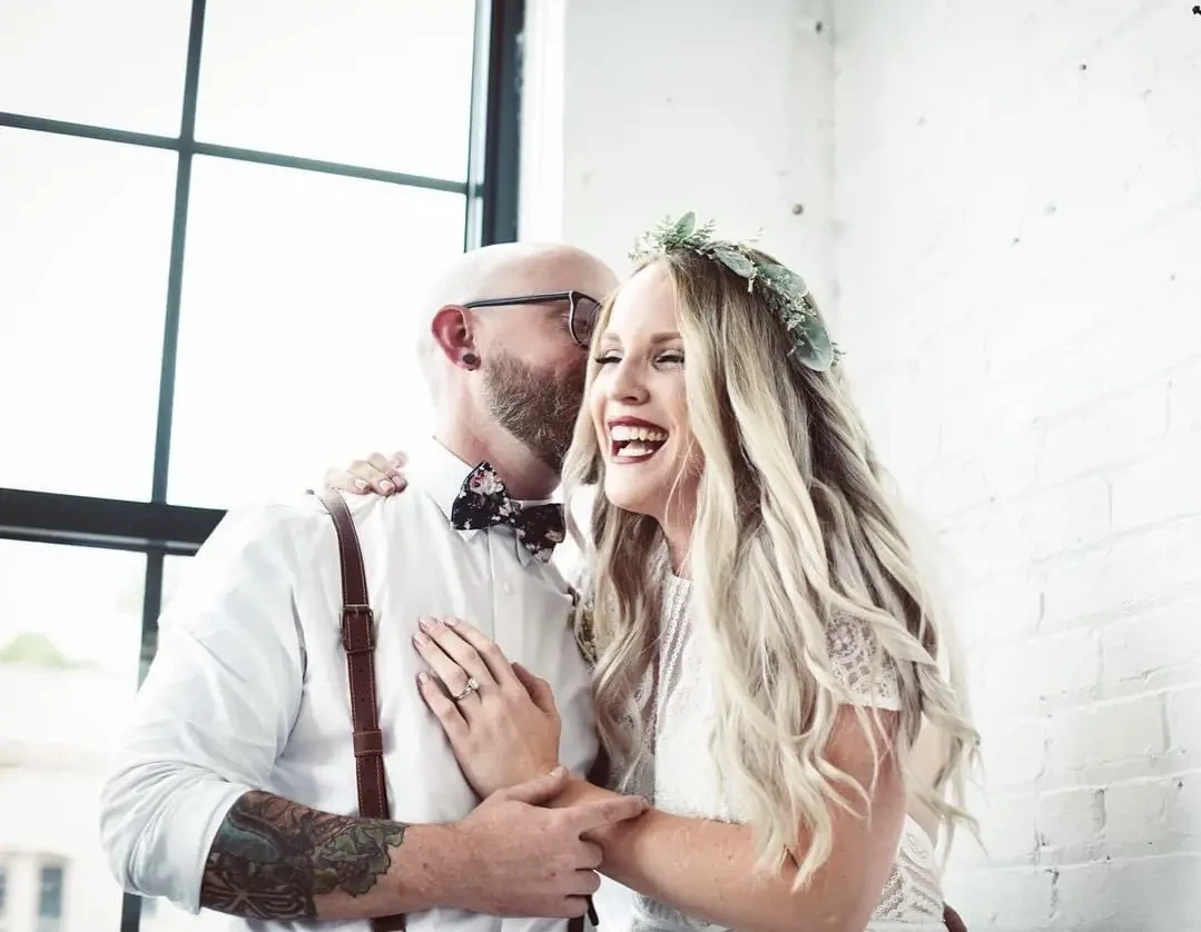 Photo of the real bride and groom kissing